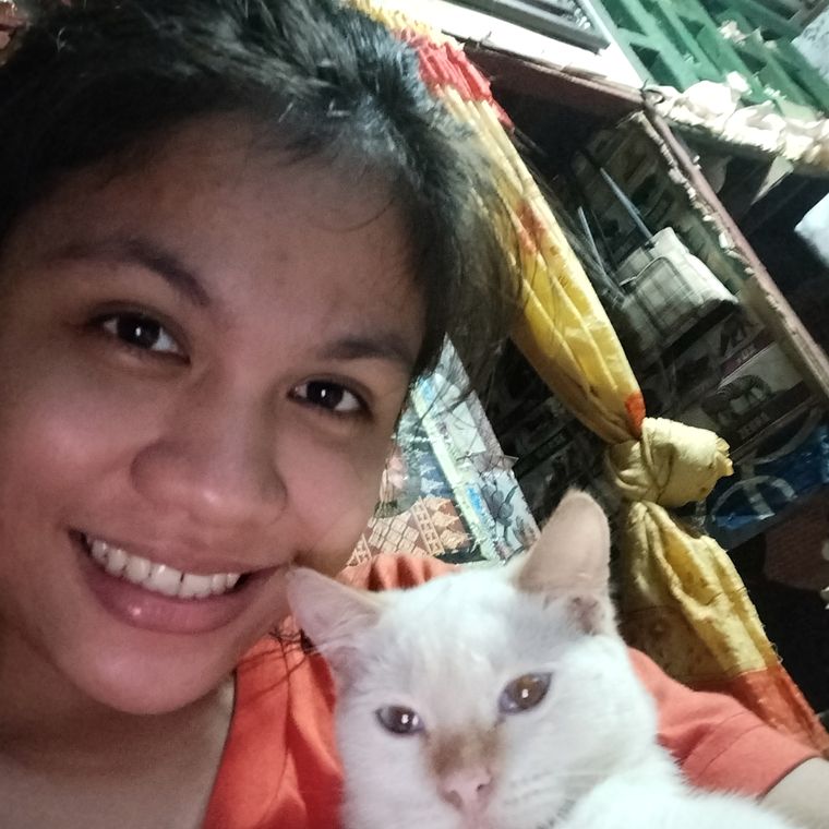 Mekaella with one of her rescued cats